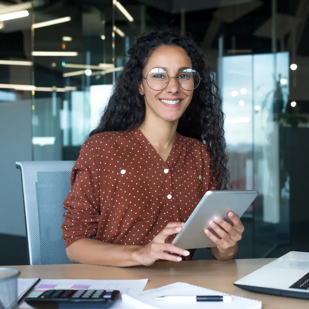 Female accountant using a tablet in a modern office setting